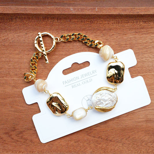 Aurelia Coast – Gilded Shell Bracelet